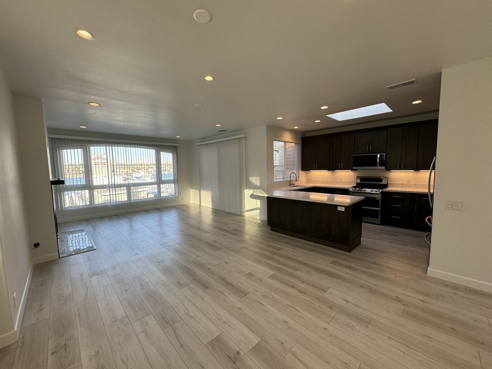 Open living room and kitchen after a whole-unit rental remodel